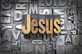 Jesus in bold vintage letterpress font on a background of scattered metal type blocks.