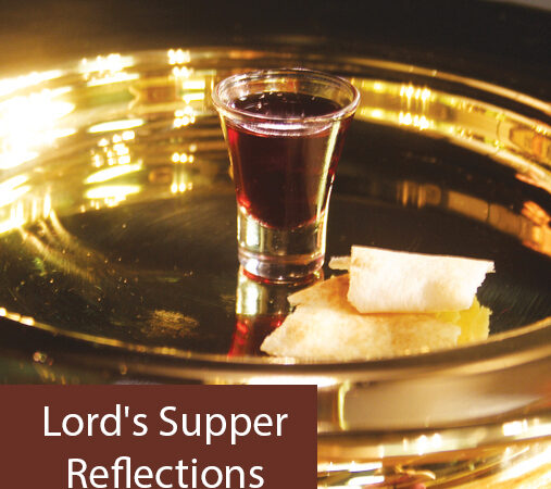Communion elements on a tray: red wine in glass, piece of bread, with text Lord's Supper Reflections.
