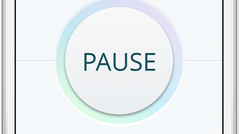 Smartphone screen showing a pause button on an app interface for controlling devices remotely.