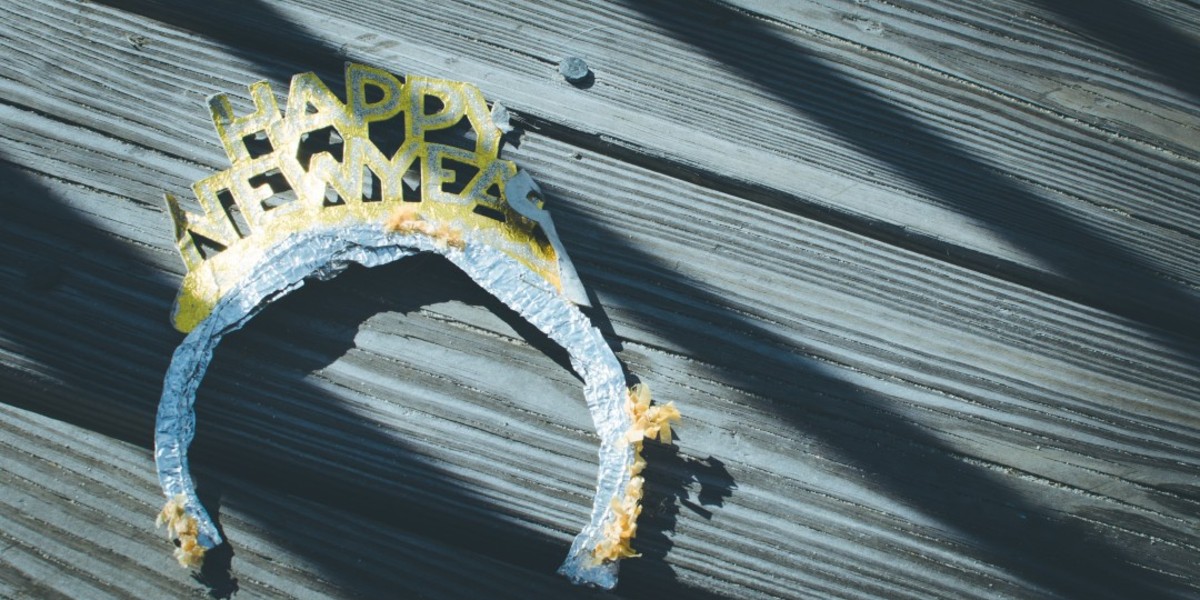 New Year's headband on wooden surface in sunlight.