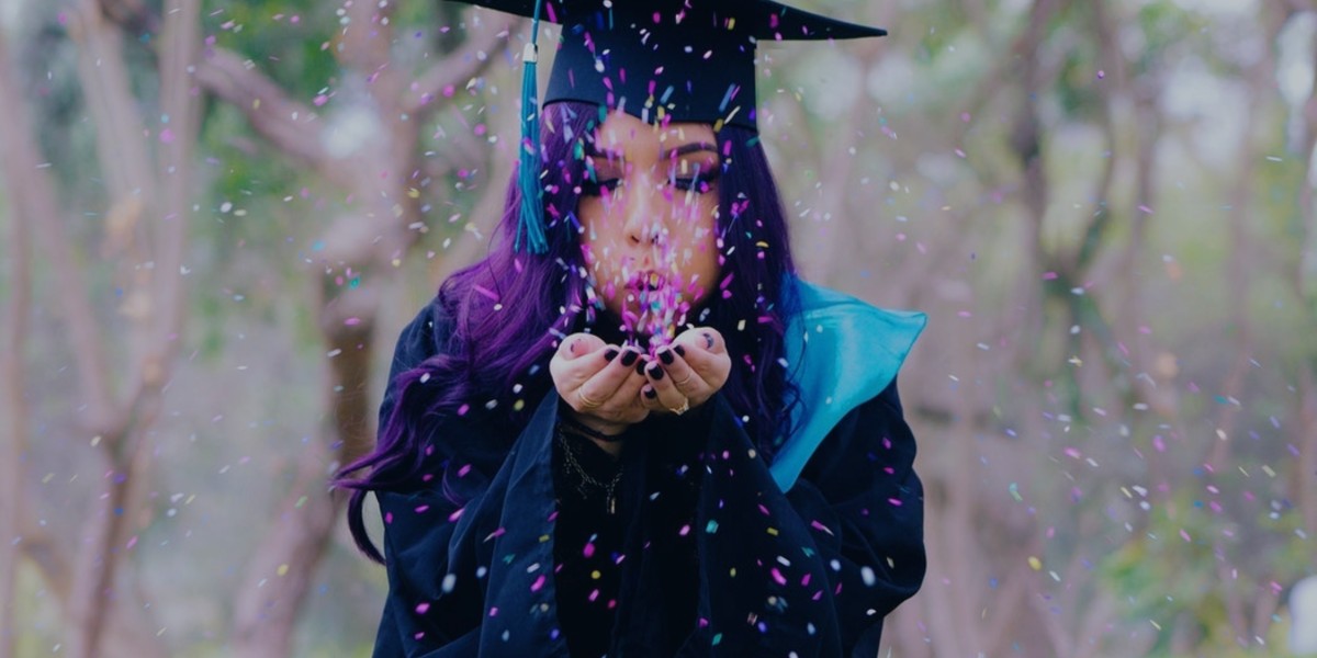 college grad with confetti