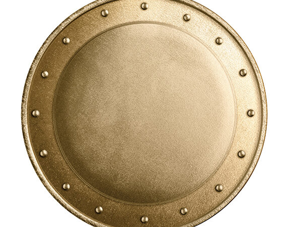 A round, textured golden shield with rivet details, viewed from above on a white background.