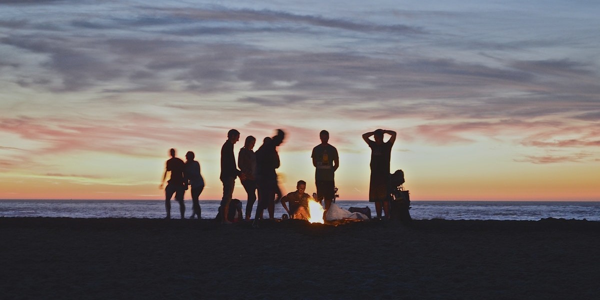 people around a campfire
