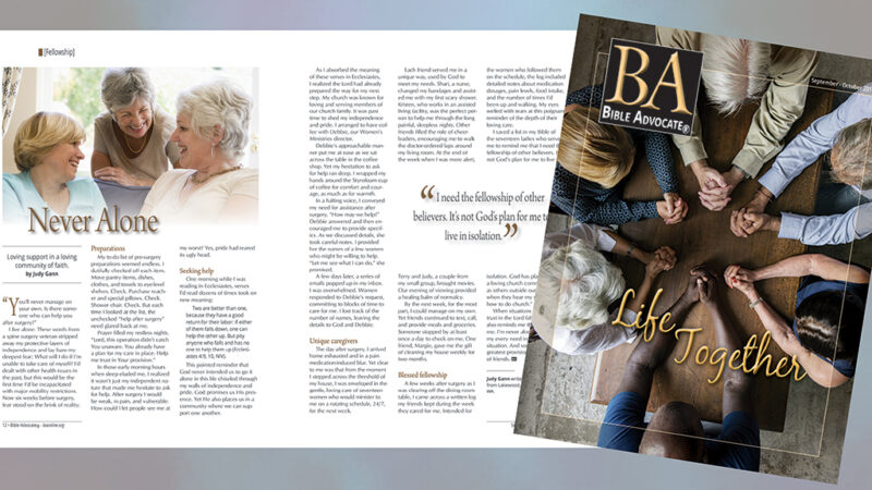 Magazine spread titled Never Alone; community of faith theme with people holding hands.
