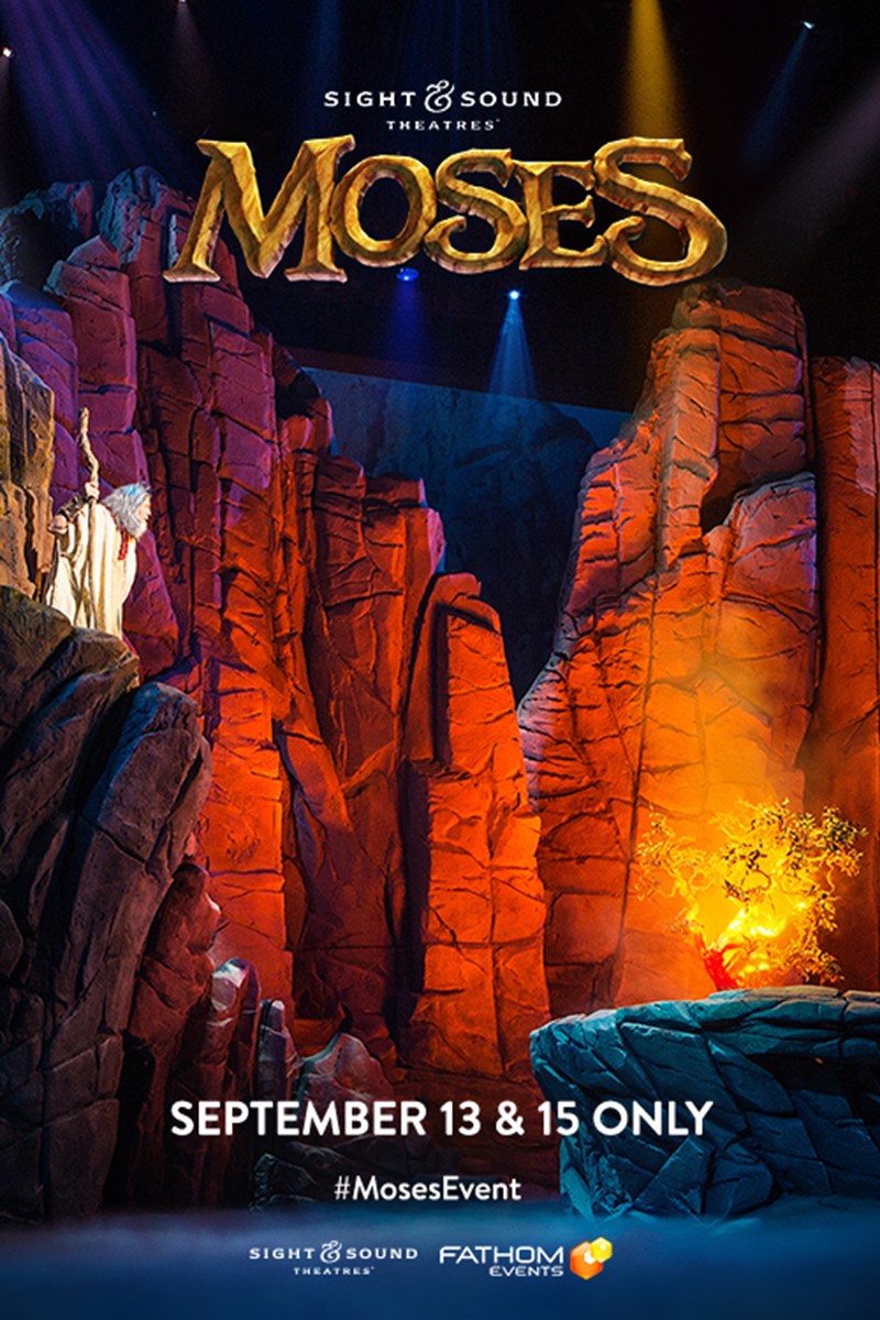 Theatrical performance of Moses by Sight & Sound Theatres, featuring dramatic rock formations and bright stage lights.