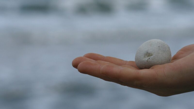 hand holding a stone