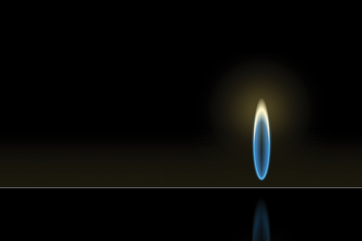 A single blue flame glows against a dark background, casting a soft light and reflection.