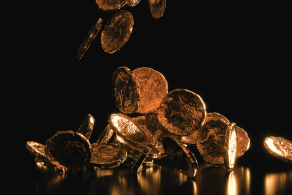 Golden and shiny Ancient Roman Coins falling on black background 3d render