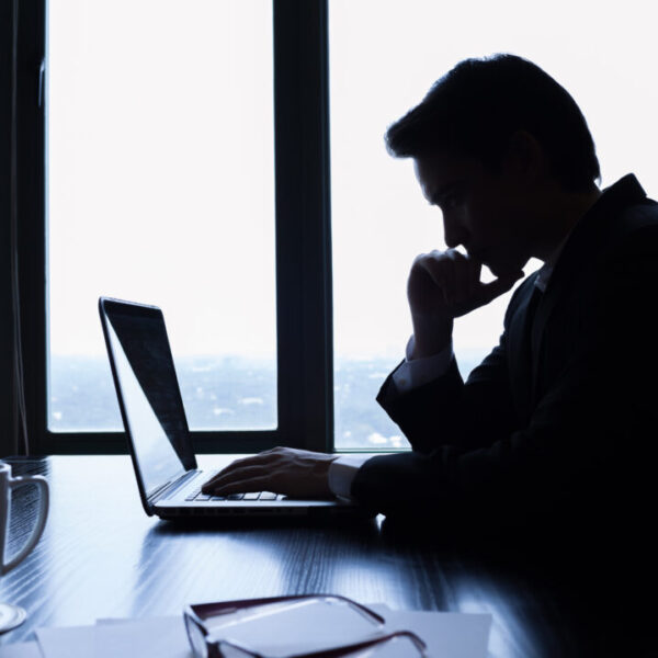 Businessman using laptop in the office