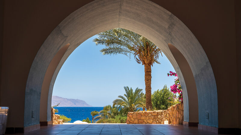 Beautiful arched doorway in a building on the shores of the Red Sea at morning in the resort town of Sharm El Sheikh, Egypt, Africa